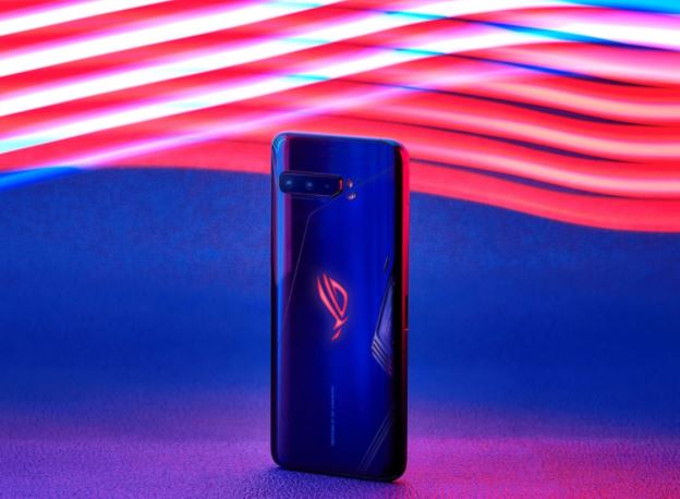 The ROG Phone 3, standing up, in front of a multicoloured background