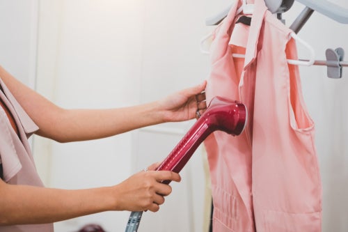 Can a garment steamer replace a clothes iron?