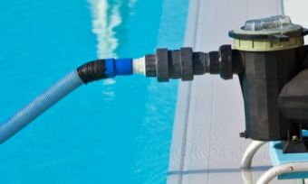 Pool pump operating in pool