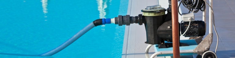 Pool pump operating in pool