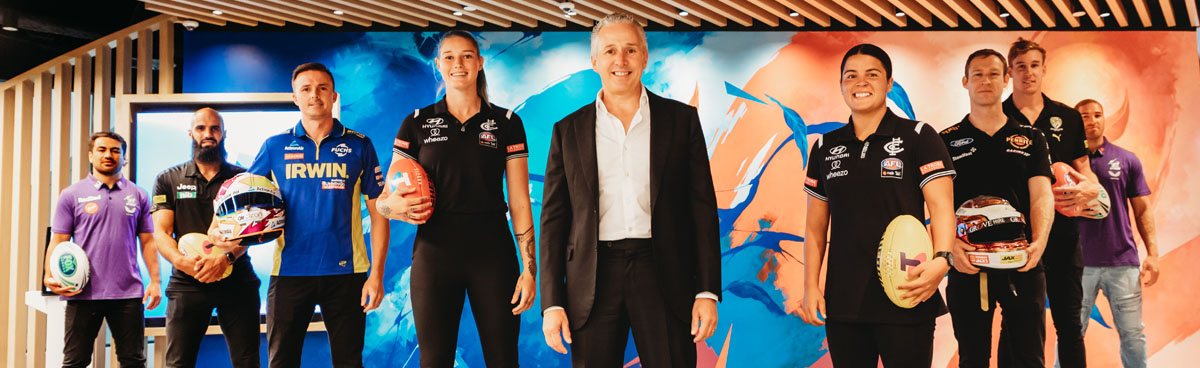 Telstra CEO Andy Penn with Australian athletes