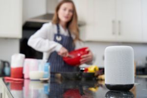 Cooking in kitchen with smart speaker