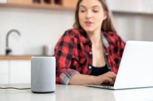 Woman using smart speaker