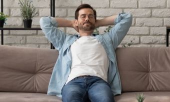 Man relaxing on couch in living room