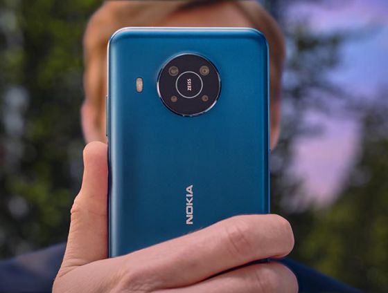 Nokia X20 phone in blue being held in man's hand
