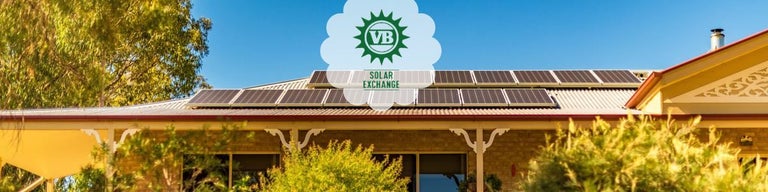 Solar panels on house roof with VB Solar Exchange logo