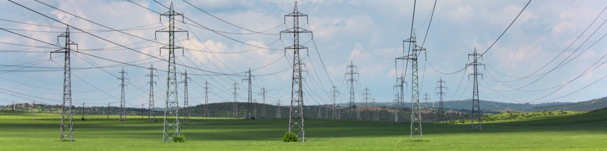 Powerlines over green open space