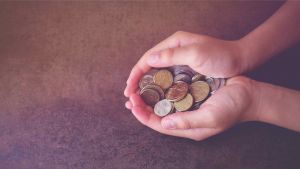 Hands holding Australian money