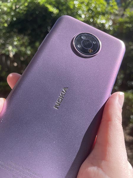 Closeup of back of purple Nokia G10 being held