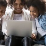 A family using a laptop