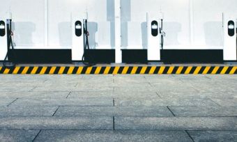 EV charging stations lined up against a wall