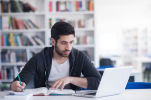 Male student studying online