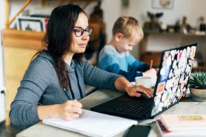 Mum studying at home with child