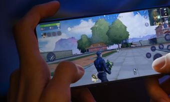 Closeup of person playing game on OPPO A94 5G phone