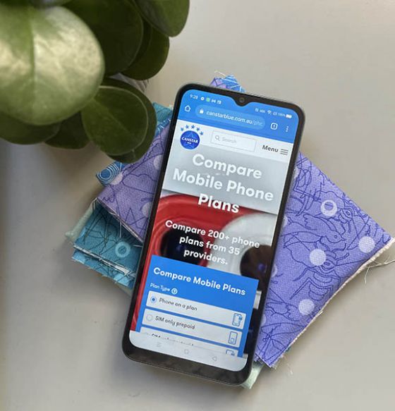 Screen of Realme C21 phone styled with fabric and pot plant