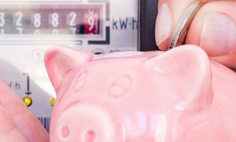 Piggy bank in front of a usage meter
