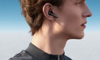 A person using the OPPO Enco X wireless earphones