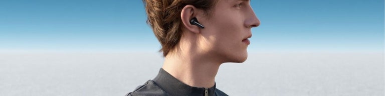 A person using the OPPO Enco X wireless earphones