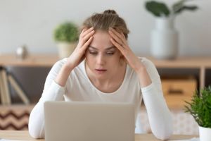 Female student frustrated with online learning