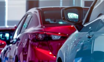 Cars lined up in a show room