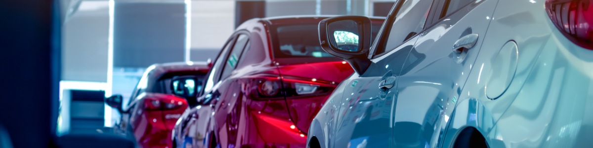 Cars lined up in a show room