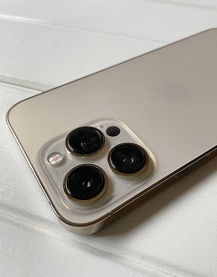 Closeup of camera bump on gold iPhone 13 Pro