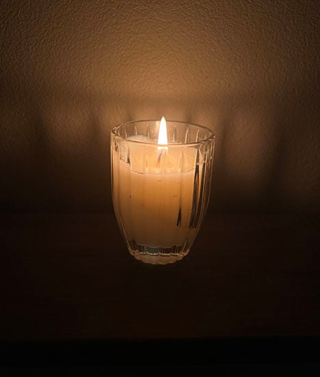 Photo of candle in dark room