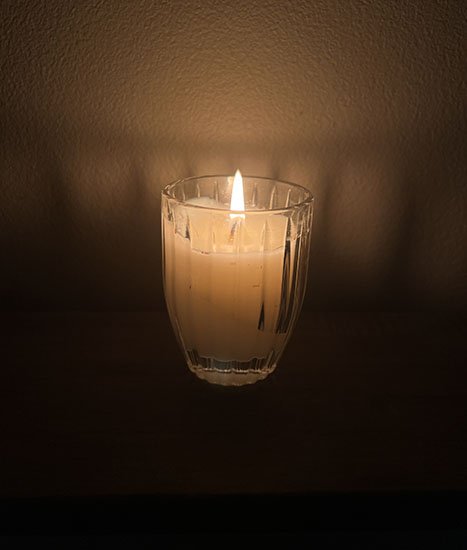 Photo of candle in dark room