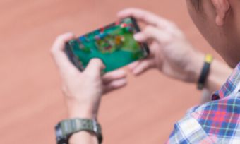 Man playing games on phone