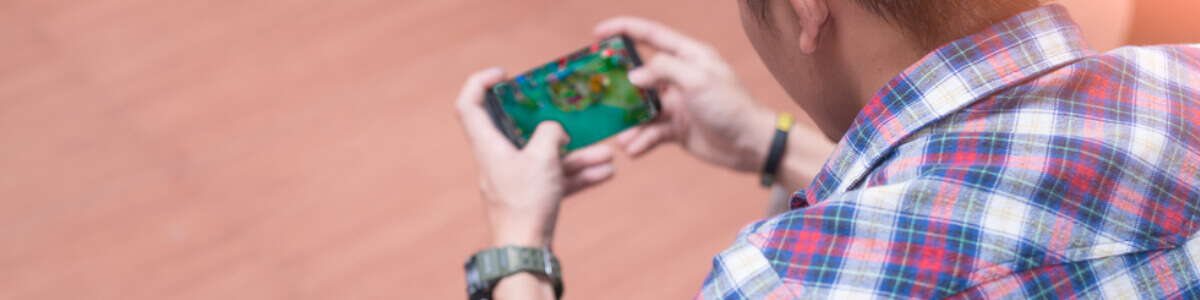 Man playing games on phone