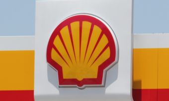 Shell logo above a service station