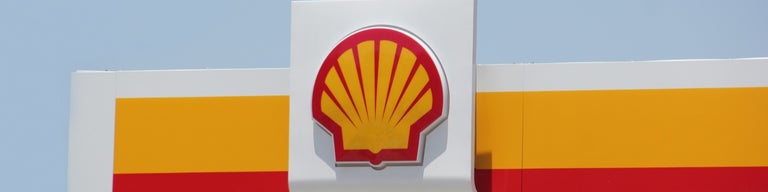 Shell logo above a service station