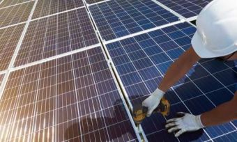 Man installing solar panels