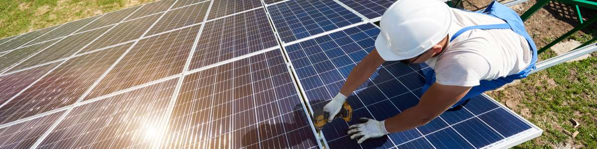 Man installing solar panels