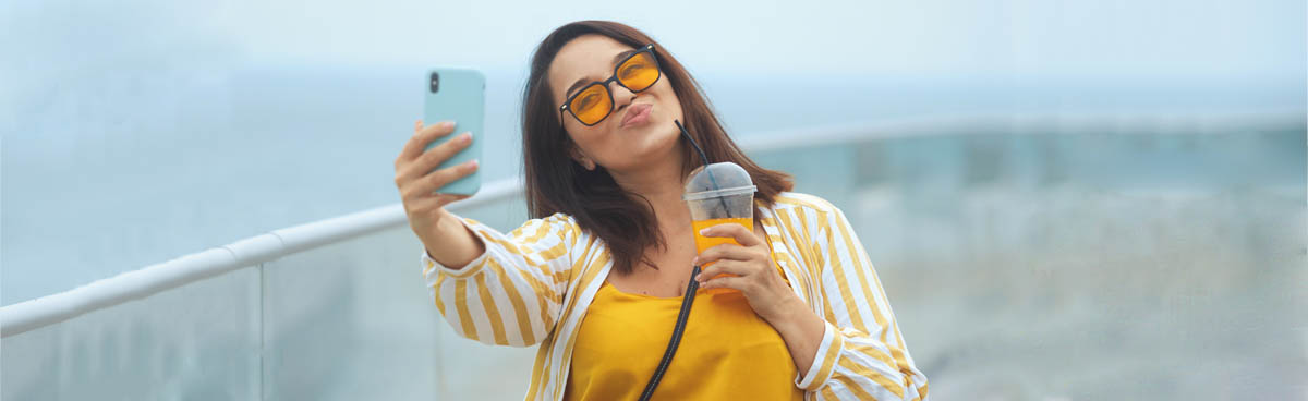 Young woman using phone outdoors