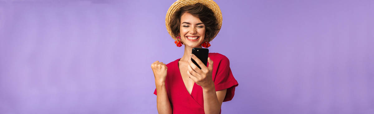 Smiling woman using smartphone