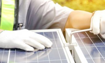 Man putting together solar panels