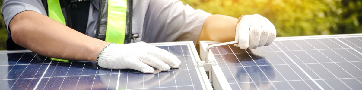 Man putting together solar panels