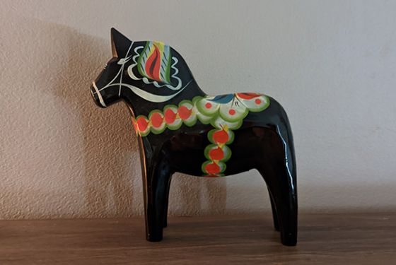 Black Swedish Dala horse on shelf