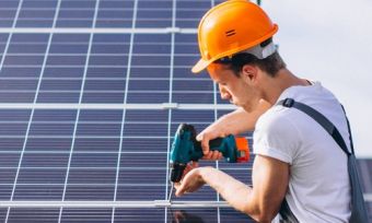 Technician installing solar panels