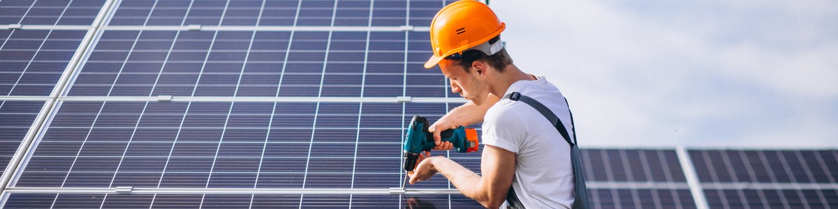 Technician installing solar panels