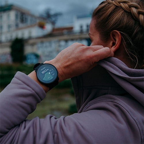 Woman wearing Suunto 9 Peak watch