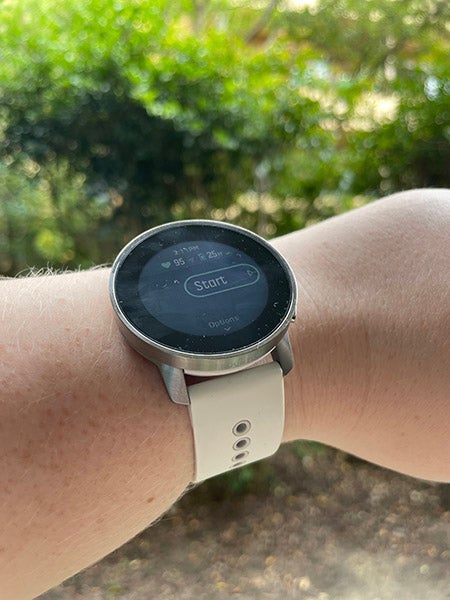 Arm wearing Suunto 9 Peak in white with sports mode on