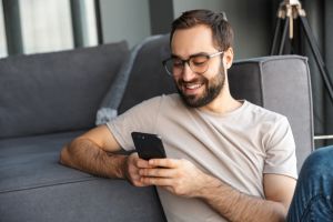 Man using phone at home