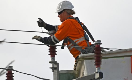 Person working on electricity wires