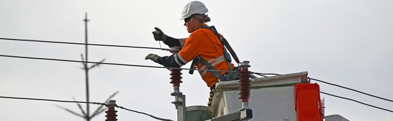 Person working on electricity wires