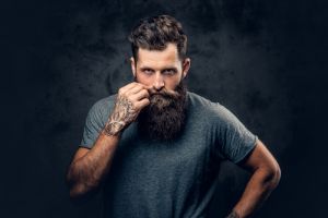 Man with beard and tattoos