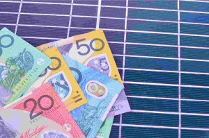Australian money placed on top of a solar PV panel