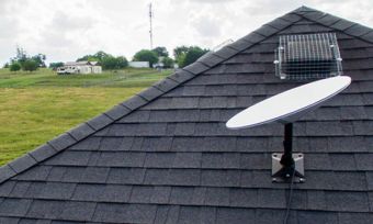 A Starlink satellite dish on a home's roof