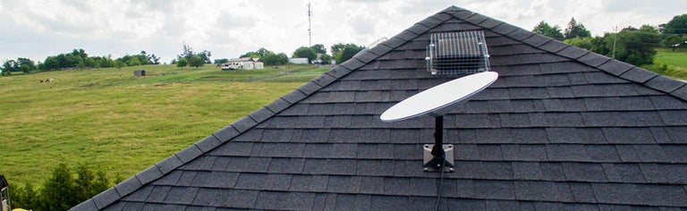 A Starlink satellite dish on a home's roof